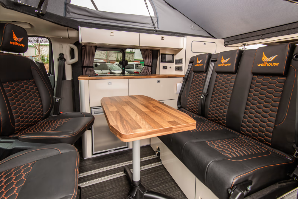 The Wellhouse Ford Misano Camper Van's fluid lines and striking paint job command attention